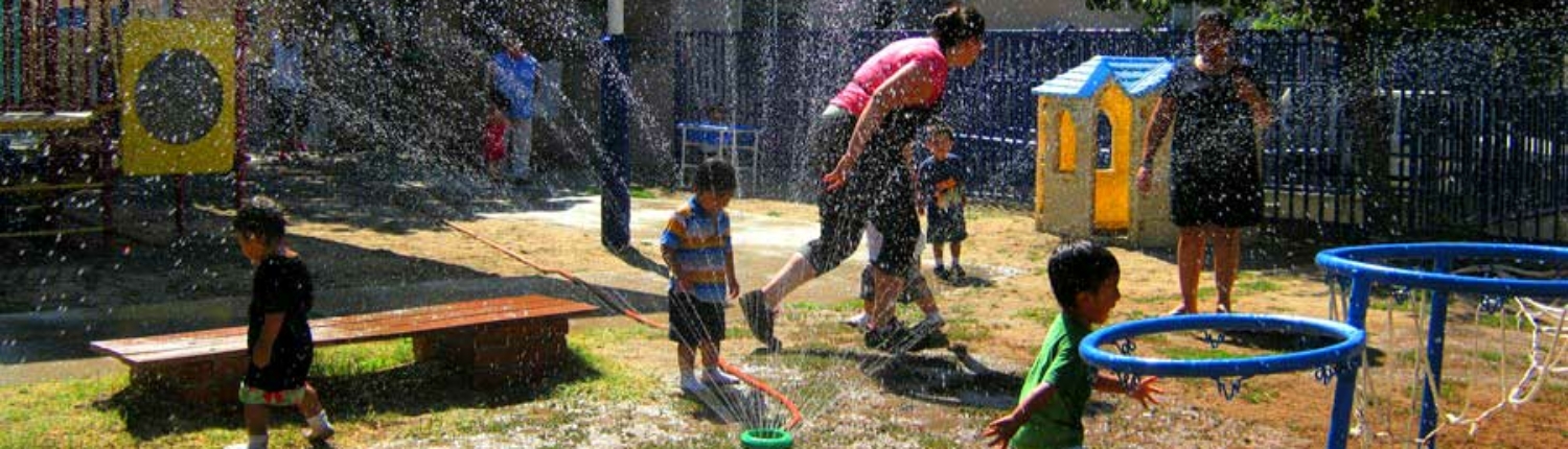 kids-playing-in-sprinklers